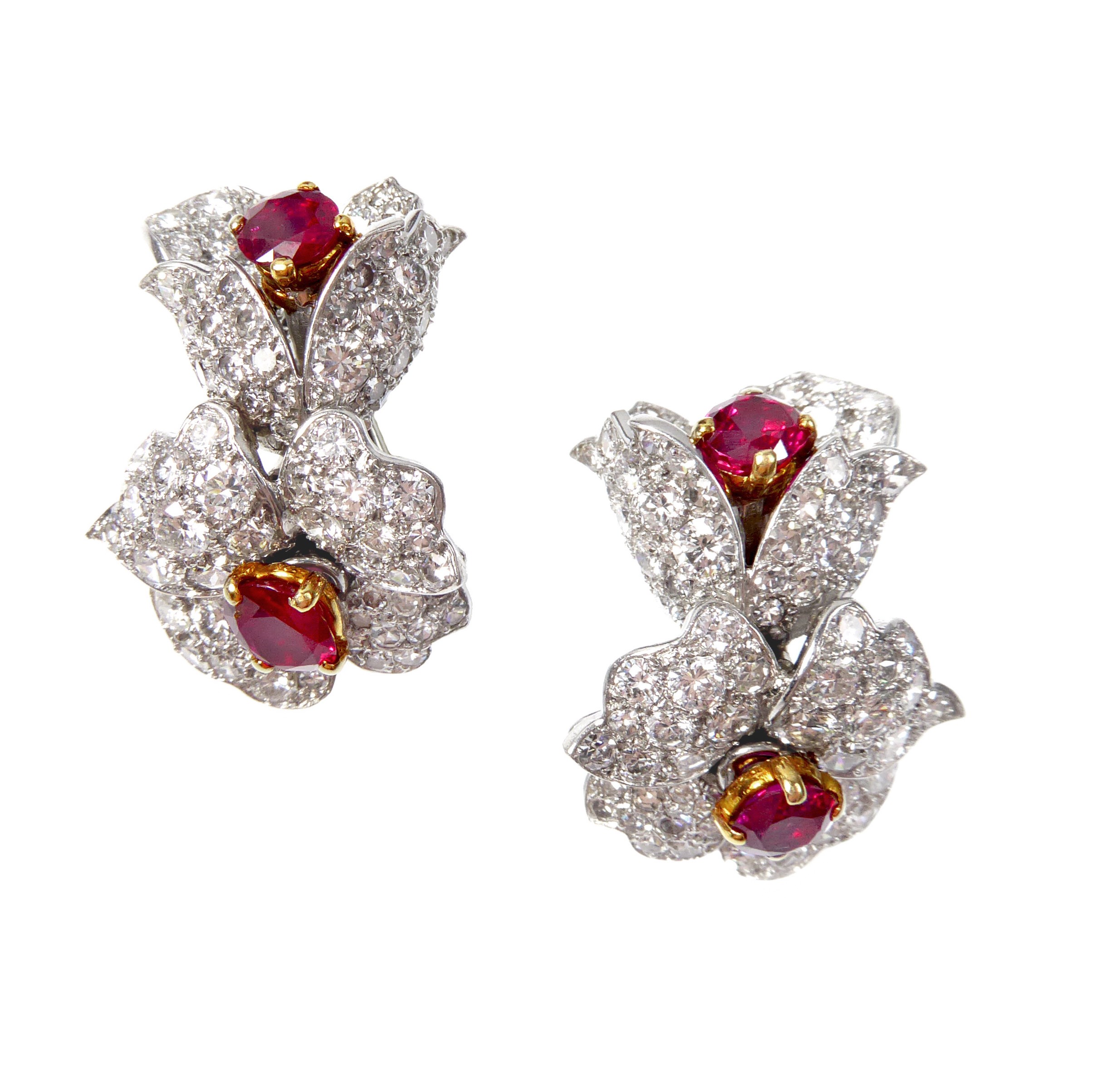 Pair of diamond and ruby flower cluster earrings by Cartier Paris