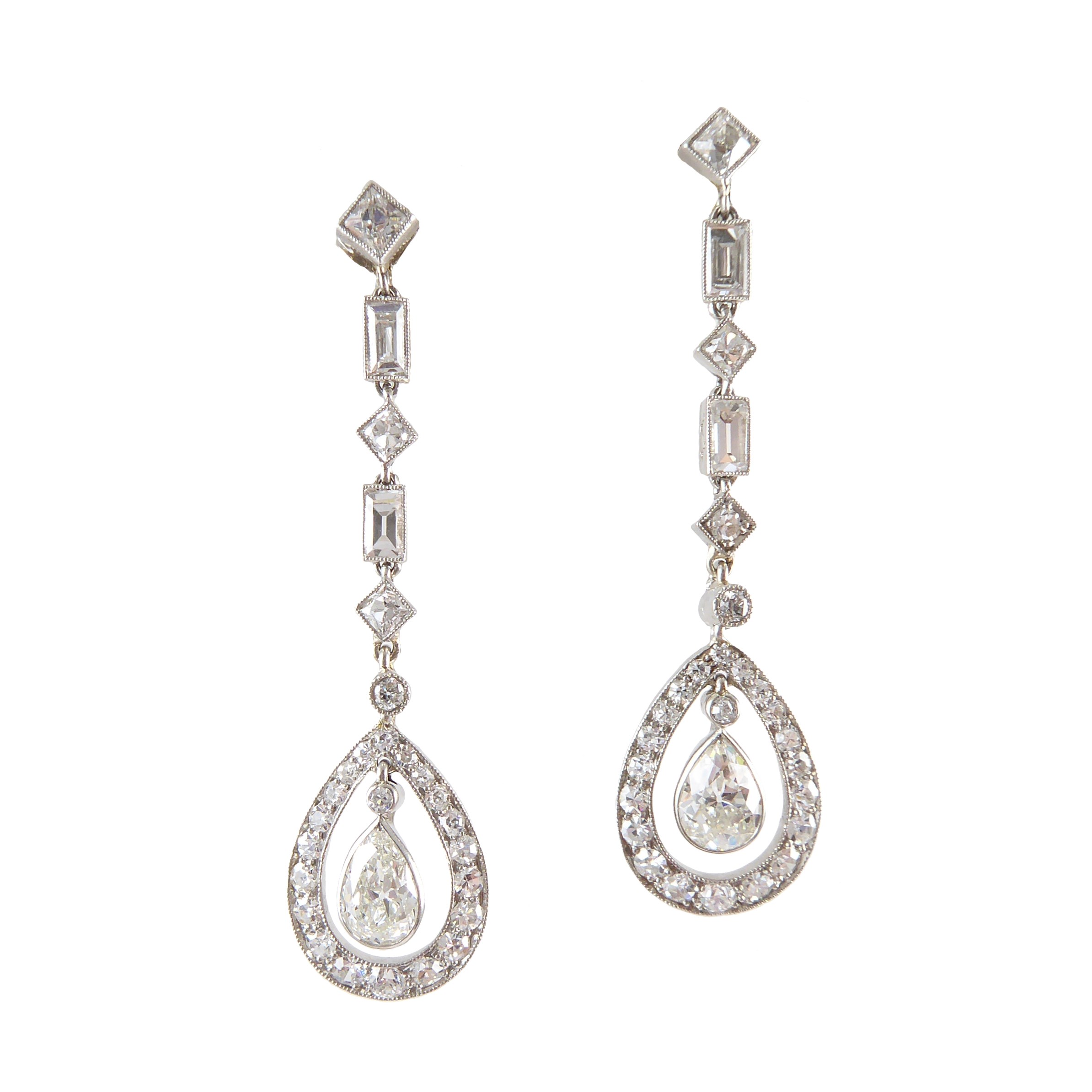 Pair of Art Deco diamond drop cluster line pendant earrings by