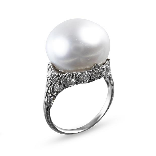 Antique single stone pearl and diamond ring, c.1900, the white bouton ...